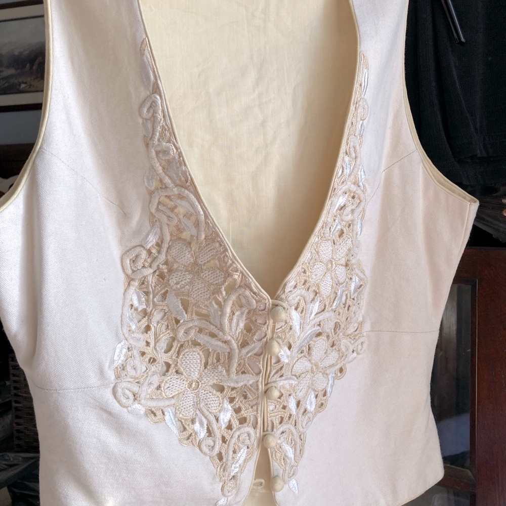Sweet embroidered vest to wear over a nice white or cream shirt.